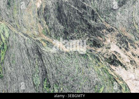 Natural marble surface gray green tone organic layer mineral pattern abstract background detail rugged structure. Textured stone slab elegant Stock Photo