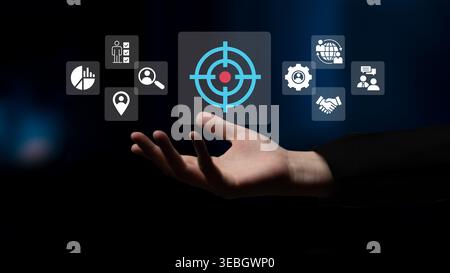 A sleek hand emerges against a dark backdrop, showcasing a digital interface with various technology icons that symbolize business strategy and Stock Photo