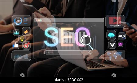 A dynamic scene showcasing business professionals engaged in a digital marketing strategy session, focusing on SEO analysis and collaboration while Stock Photo