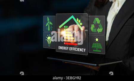 Modern Businesswoman Using Touchscreen Technology to Promote Energy Efficiency and Sustainable Practices in Home Design and Construction Quark. Stock Photo