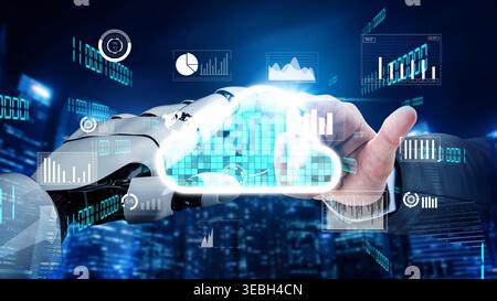 This image showcases the collaboration between a robot hand and a human hand, symbolizing data connectivity and cloud technology in a modern business Stock Photo