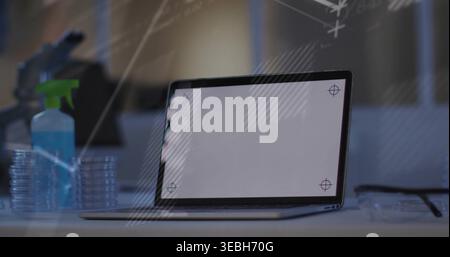Displaying laptop with screen crosshairs at lab, green-nozzle spray, petri stack, glasses, board Stock Photo