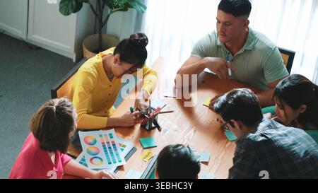 Top view of manager writing idea on sticky notes and explain idea about web design. Professional marketing team or programmer brainstorming idea while Stock Photo