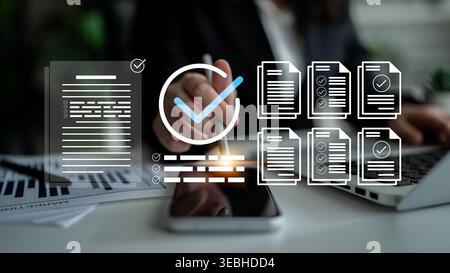 A detailed view of an office workspace featuring documents, checklists, and a smartphone, emphasizing productivity and efficiency in modern business Stock Photo