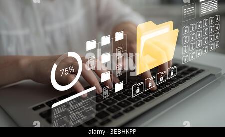 A close-up view of hands typing on a keyboard surrounded by digital file icons and data visuals, illustrating a modern and productive workspace in a Stock Photo