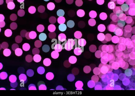 Defocused abstract background with pink and purple pastel bokeh lights. Soft romantic aesthetic for wedding, beauty and luxury branding concepts. Stock Photo