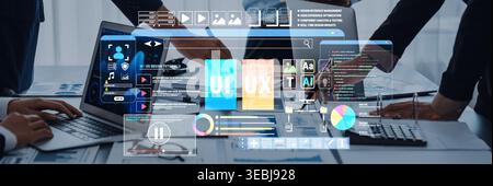Modern Digital Interface with User Interface and User Experience Concepts Displayed on a Screen During a Collaborative Meeting in an Office Setting Stock Photo