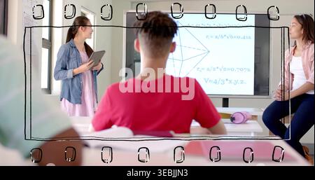 Watching seated student in red tee facing front in classroom, presenter holding tablet by display Stock Photo