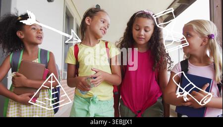 Walking four girls wearing bright clothes, chatting in school corridor, carrying bags and doodles Stock Photo
