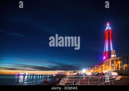 Lancashire,England,United Kingdom-August 09 2022:View along the traditional British pleasure beach promenade and across the sea,on a summer night at t Stock Photo