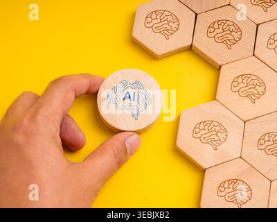 AI adoption and digital transformation concept with hand selecting artificial intelligence icon among human brain symbols. Smart decision making, tech Stock Photo