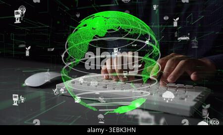 This image illustrates the intersection of technology and ecology, showcasing hands typing on a keyboard against a green globe and digital icons Stock Photo