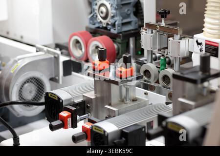 Industrial woodworking machinery processing timber and creating wood ...