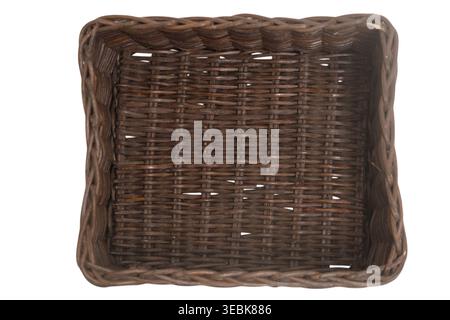Woven square basket on isolated white background. Brown wicker container for storage and home organization. Empty traditional handicraft accessory for Stock Photo