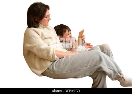 Woman and small boy using tablet computer together. Mother and child looking at screen of device. Family lifestyle digital learning activity. Isolated Stock Photo