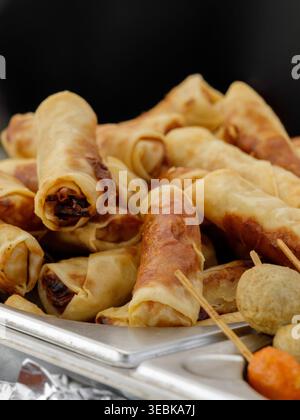 Golden Spring Rolls With Savory Filling. Stacked Crispy Spring Rolls On Tray Ready To Serve Stock Photo