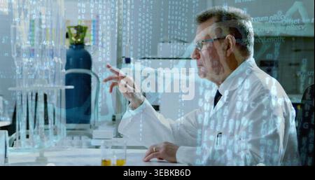 Reaching senior scientist in lab coat interacting with data overlay at bench with vials, copy space Stock Photo