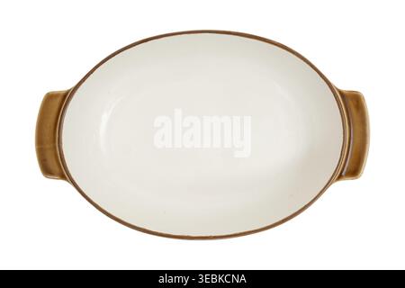 Empty stoneware baking dish with brown ceramic rim. Oval casserole pan on isolated white background. Kitchen cookware for dinner meal preparation, ser Stock Photo