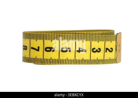 Yellow measuring tape rolled up on white background. Tool for garment sewing, tailoring and body measurement. Metric scale device for fashion design, Stock Photo