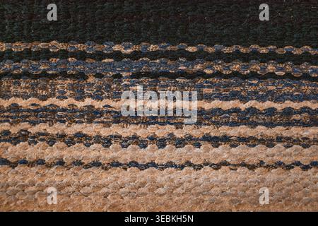Colorful handmade rag rug texture, striped woven fabric background with blue and green threads Stock Photo