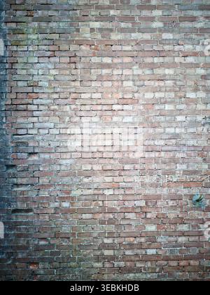 ANNAKA, JAPAN - APR 25, 2026: Weathered red brick wall texture from historic 19th-century railway infrastructure along the Abt-no-Michi trail. Stock Photo