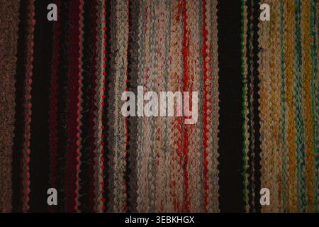 Colorful handmade rag rug texture, striped woven fabric background with blue and green threads Stock Photo