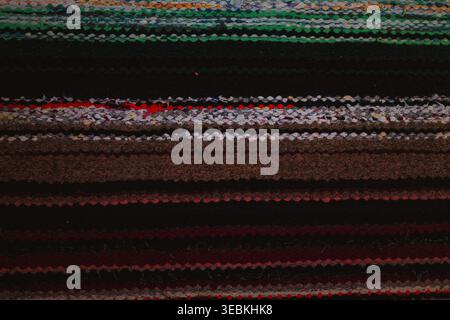 Colorful handmade rag rug texture, striped woven fabric background with blue and green threads Stock Photo