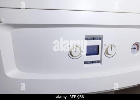 Combi gas boiler control panel with digital display. Set your house temperature. Smart  energy savings Stock Photo