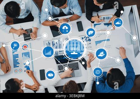 Engaging scene of business professionals collaborating on data analysis with charts and graphs, utilizing modern technology to drive insights and Stock Photo