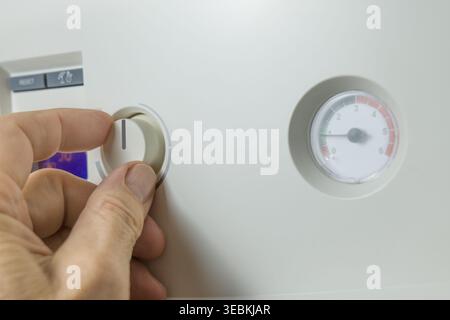 Combi gas boiler control panel with digital display. Set your house temperature. Smart  energy savings Stock Photo