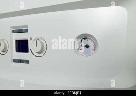 Combi gas boiler control panel with digital display. Set your house temperature. Smart  energy savings Stock Photo