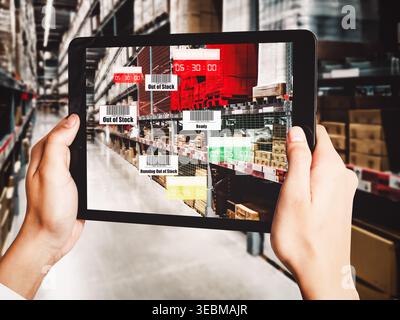 Smart warehouse management system using augmented reality technology to identify package picking and delivery . Future concept of supply chain and Stock Photo