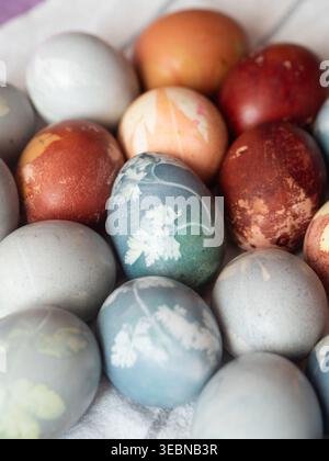 Brown, Blue and Orange Dyed Easter Eggs with Floral Imprints Stock Photo