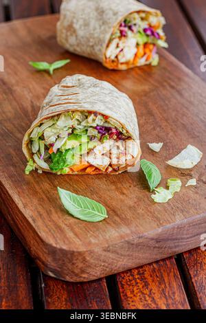 Close up of a chicken wrap filled with fresh vegetables Stock Photo