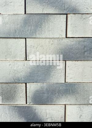 close up texture of weathered grey and white brick wall pattern Stock Photo