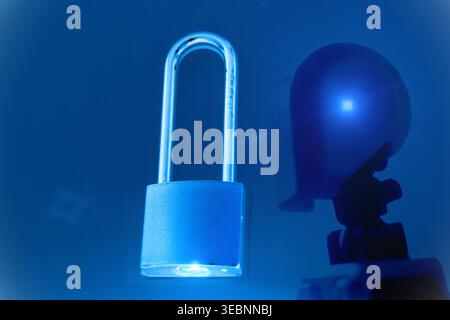 A cinematic close-up of a humanoid robot head in a sleek futuristic setting, surrounded by soft blue lighting and digital glow effects. A metallic pad Stock Photo