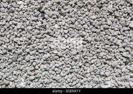Close-up of white gravel texture with small irregular stones Stock Photo