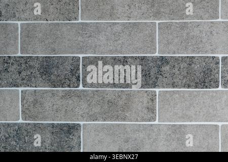 Close-up of gray brick wall with white mortar joints Stock Photo