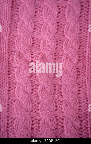 Pink cable Knit Fabric wool sweater background. Stock Photo