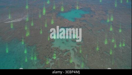 Showing aerial coral reef and shallow turquoise lagoon from drone view, with green binary overlay Stock Photo