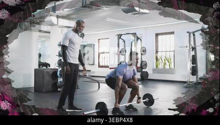 Lifting male trainee wearing purple tee and dark shorts doing hip hinge at gym with barbell. Athlete, coach, training, strength, focus, rack, plates Stock Photo