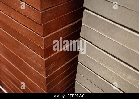 stacked paving slabs in two colors at construction materials yard, close up texture detail. Concept: building materials choice Stock Photo