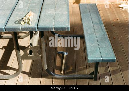 Pruning Shears on Outdoor Picnic Table and Wooden Deck Stock Photo