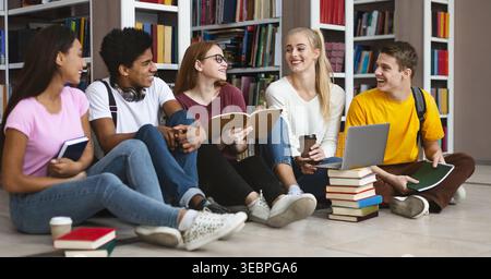 Group of Students Studying Together in a Library While Enjoying Their Time and Sharing Ideas Stock Photo