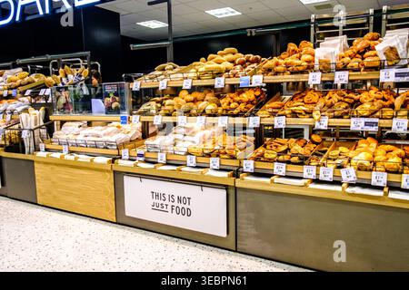 London UK, April 25, 2026, Selection of Freshly Baked Bread Rolls and Pastries In-Store Bakery With No People Stock Photo