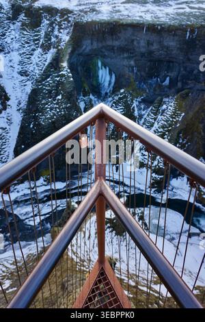 Rusty Railing And Love Padlock Overlooking Snowy Canyon Viewpoint From A Scenic Cliff Edge Stock Photo