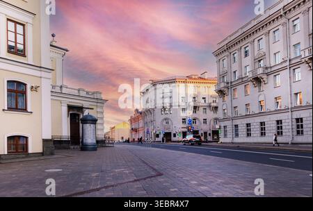 Intersection of Karl Marx and Engels streets with Stalinist architecture buildings featuring metro station entrances in arches. Communist heritage in Stock Photo