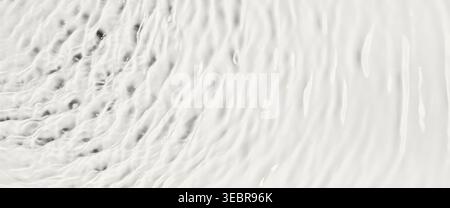 White fluid creating rippled surface with rhythmic wave patterns, banner format Stock Photo