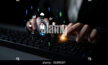 Digital Security Concept with User Interacting on Keyboard Surrounded by Various Security Icons and Data Symbols for Cyber Protection Visualization Stock Photo