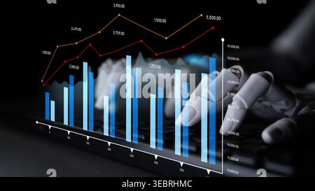 This image captures data analysis in finance, showcasing bar graphs and line charts with hands on a keyboard. Ideal for business and technology Stock Photo
